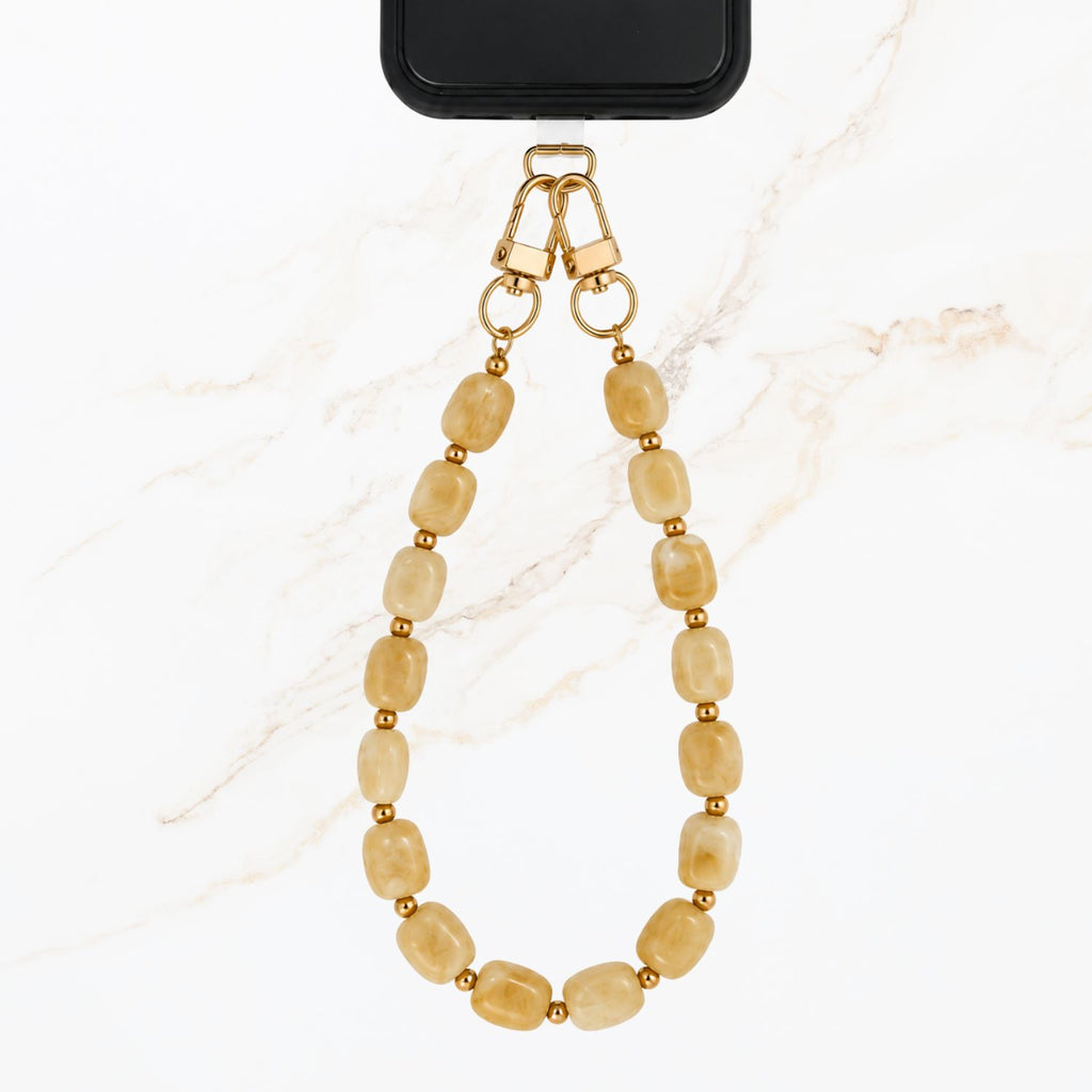 Beige telefoonkoord met rvs gouden balletjes