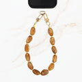 Bruine telefoonketting met grote stenen