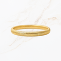 Elastische goudkleurige bangle