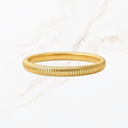 Elastische goudkleurige bangle