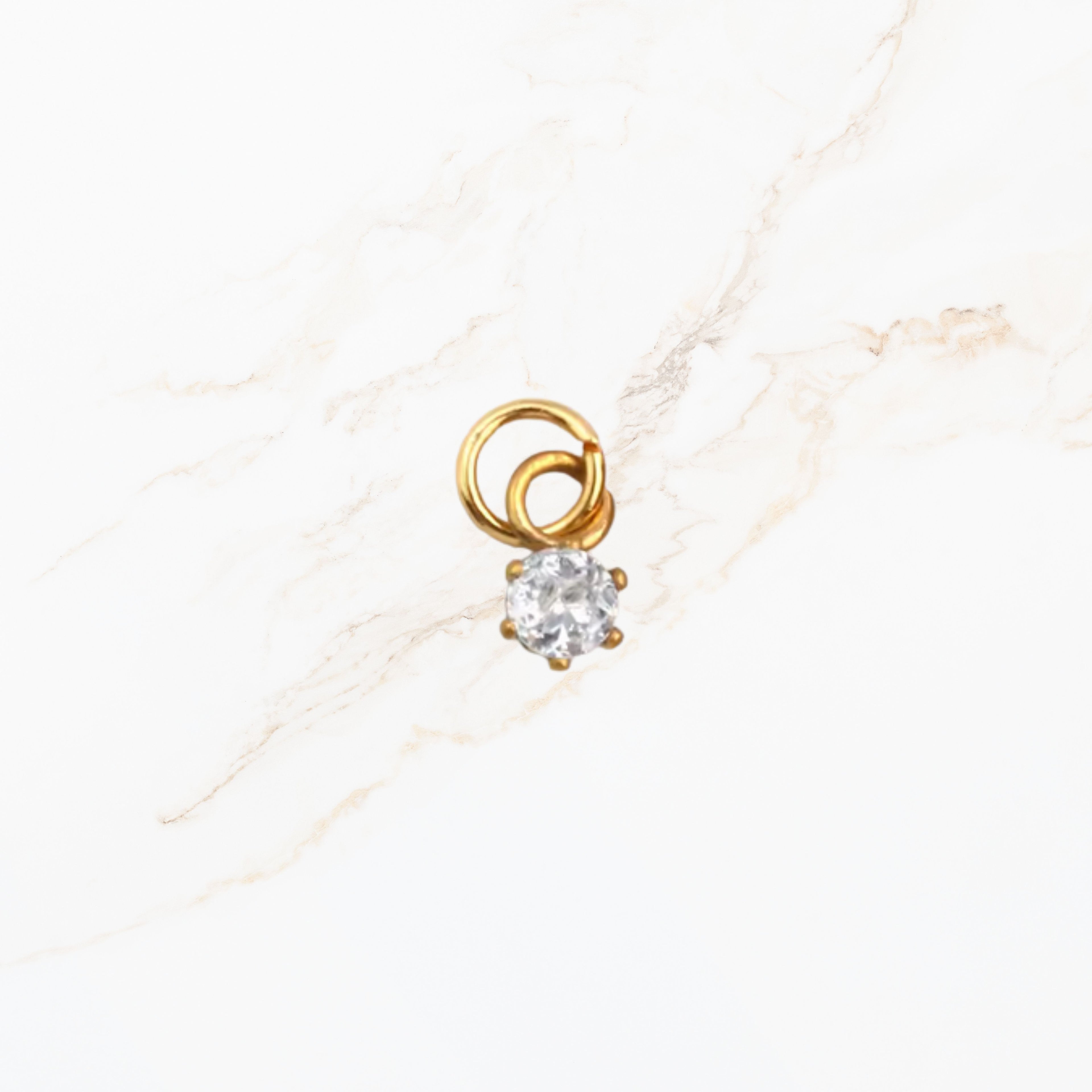 Geboortesteen ronde bedel april met diamantkleurige edelsteen