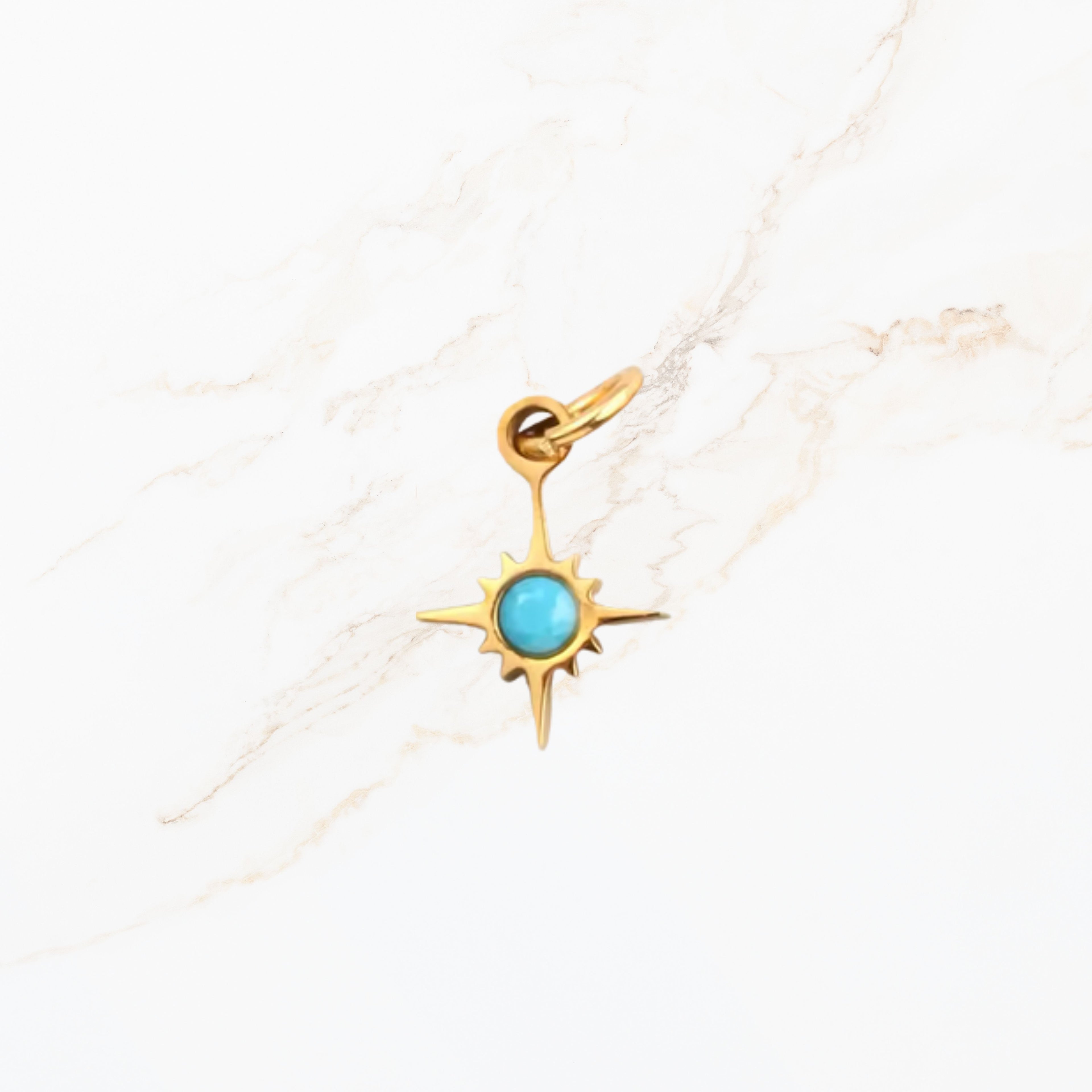 Geboortesteen ster bedel december met turquoise blauwe edelsteen