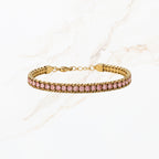 Goudkleurige tennisarmband voor dames met roze steentjes en verstelbare sluiting