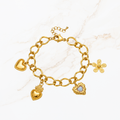 Goudkleurige bedel armband met hartjes en bloem