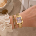 Seyso horloge met roze wijzerplaat en gouden schakelband