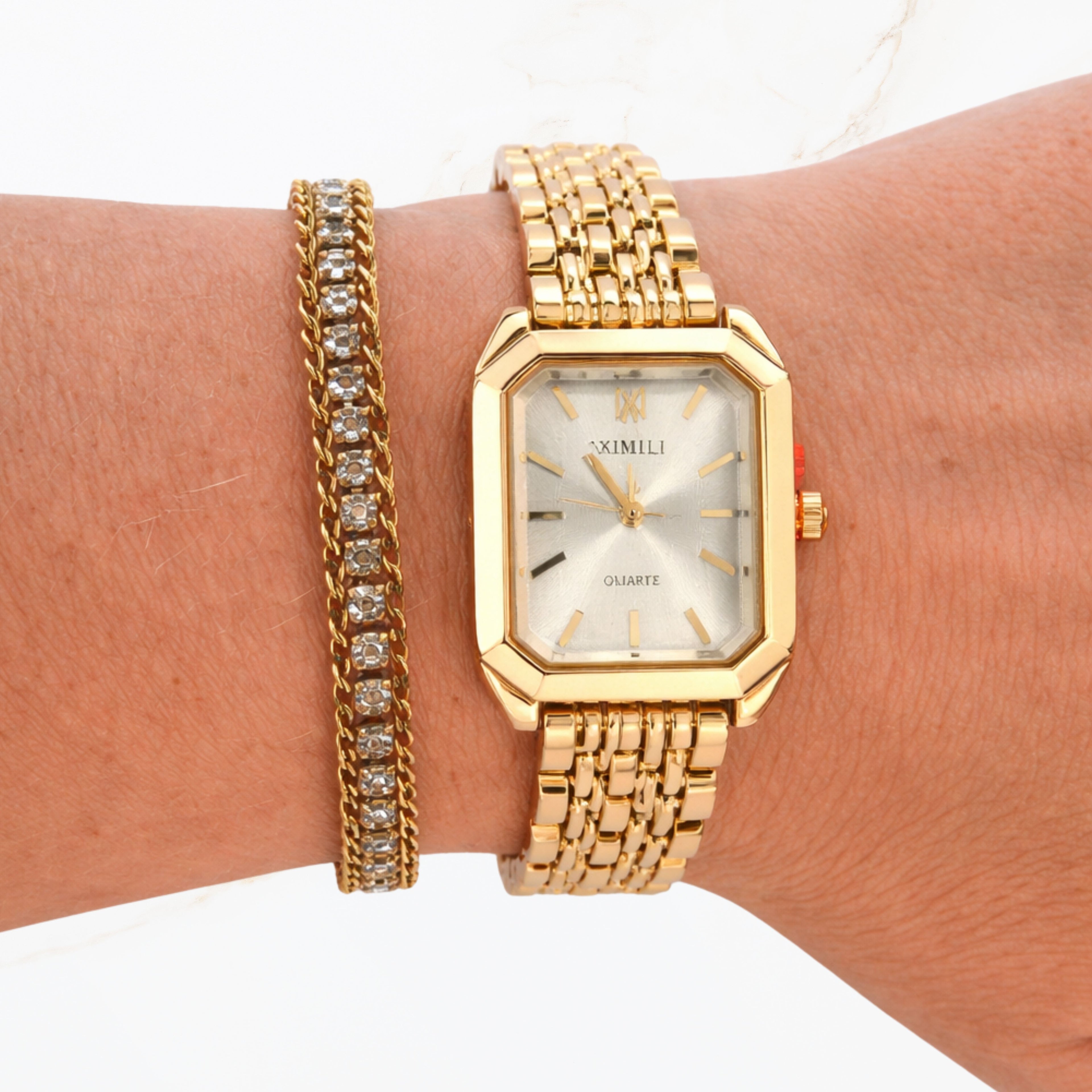 Seyso horloge met witte wijzerplaat en gouden schakelband