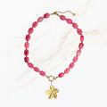 Roze ketting met goudkleurige bedel