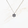 Zilverkleurige stainless steel schakelketting van 45 cm plus 5 cm met bloemhanger en subtiel steentje