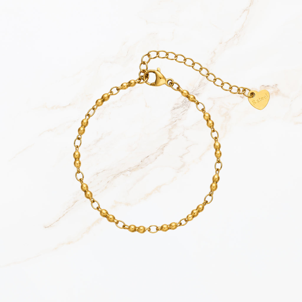 Fijne goudkleurige kralen armband voor dames met verstelbare sluiting