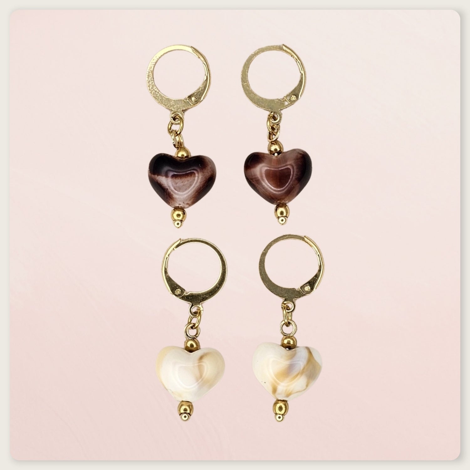 Seyso hartvormige agaat oorbellen met goudkleurige stainless steel hoops en zachte beige natuursteen in elegant en tijdloos design.