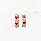 Seyso mini hoops met roze hartjes in goudkleurige setting klein model