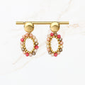Ovale oorbel met Roze, beige, grijze kralen