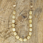 Beige telefoonkoord met rvs gouden balletjes